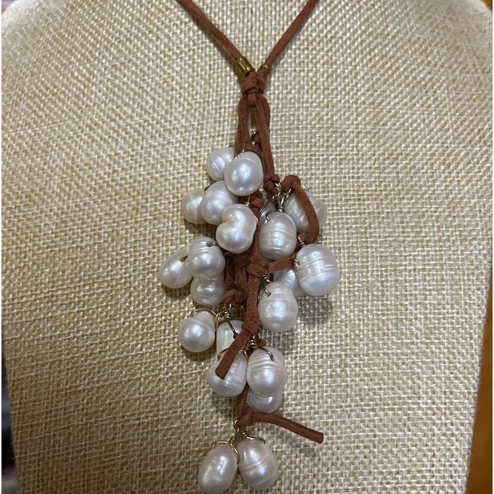 Genuine Potatoe Pearls on brown leather cord.